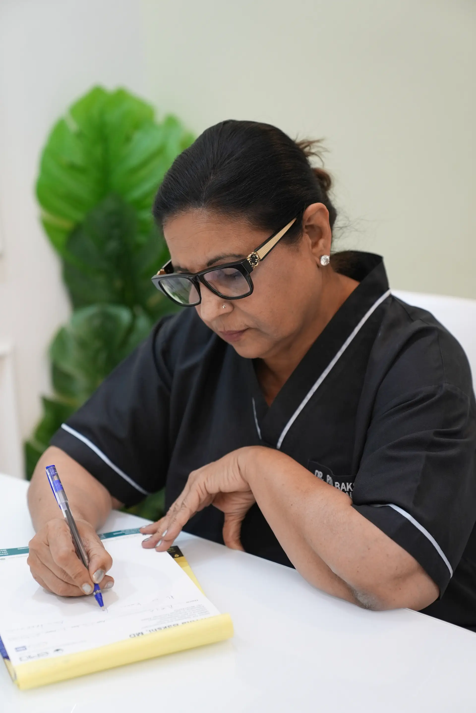 Dr. Rita Bakshi reviewing a patient's baseline records