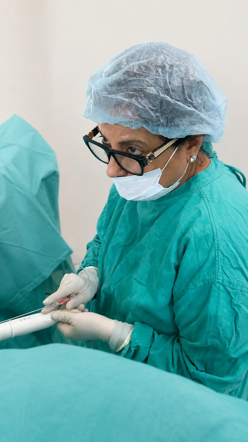 Dr. Rita Bakshi in consultation with a patient, warm, natural light, genuine conversation